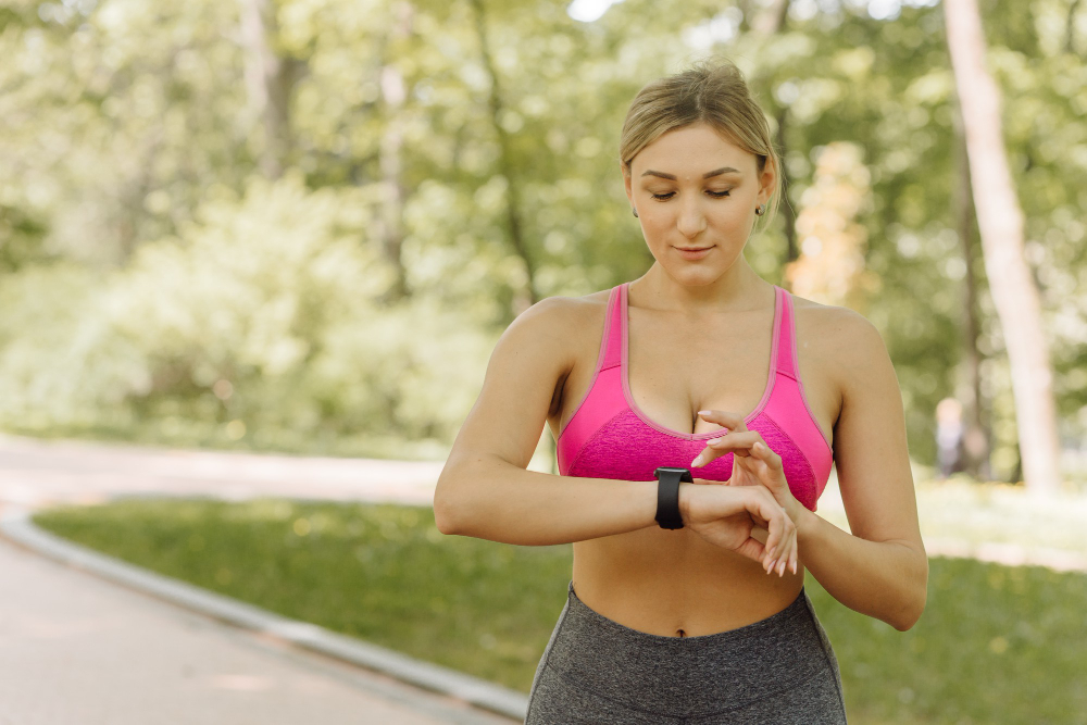 woman checking fitness watch