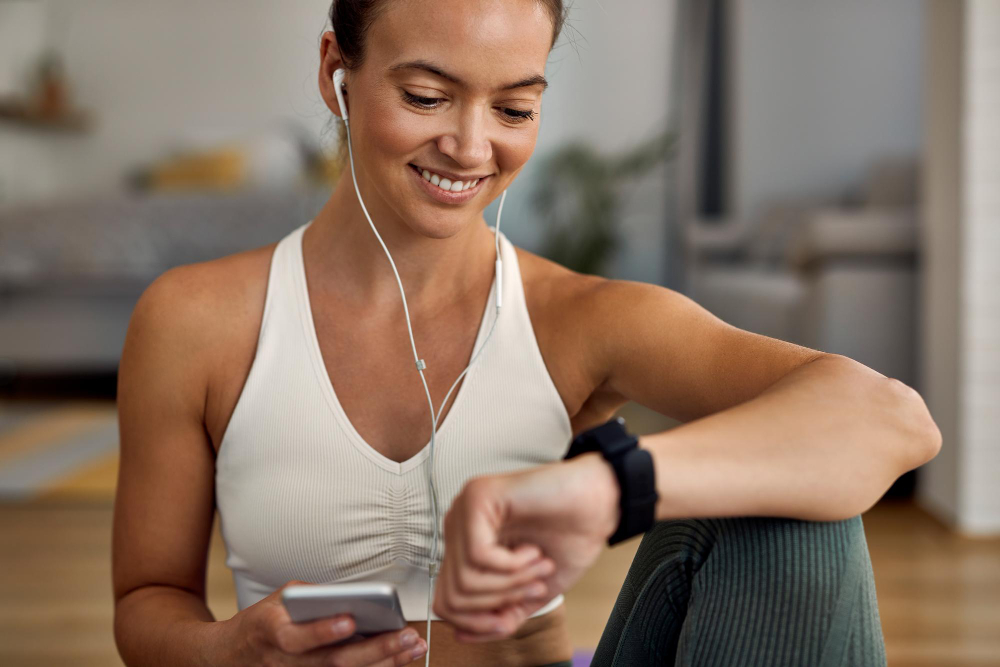 woman healthy lifestyle with wearable tech indoors