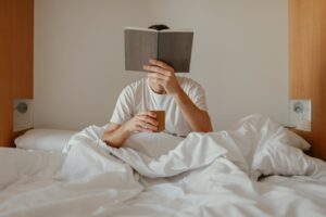 men reading in bed