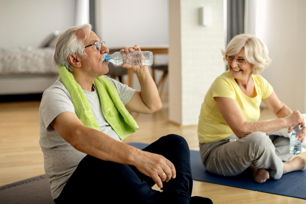 two seniors sitting and relaxing post-workout