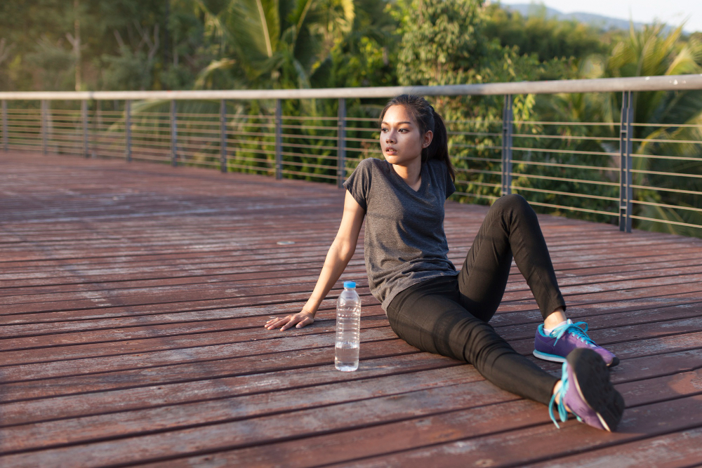 tired woman sitting after exercise