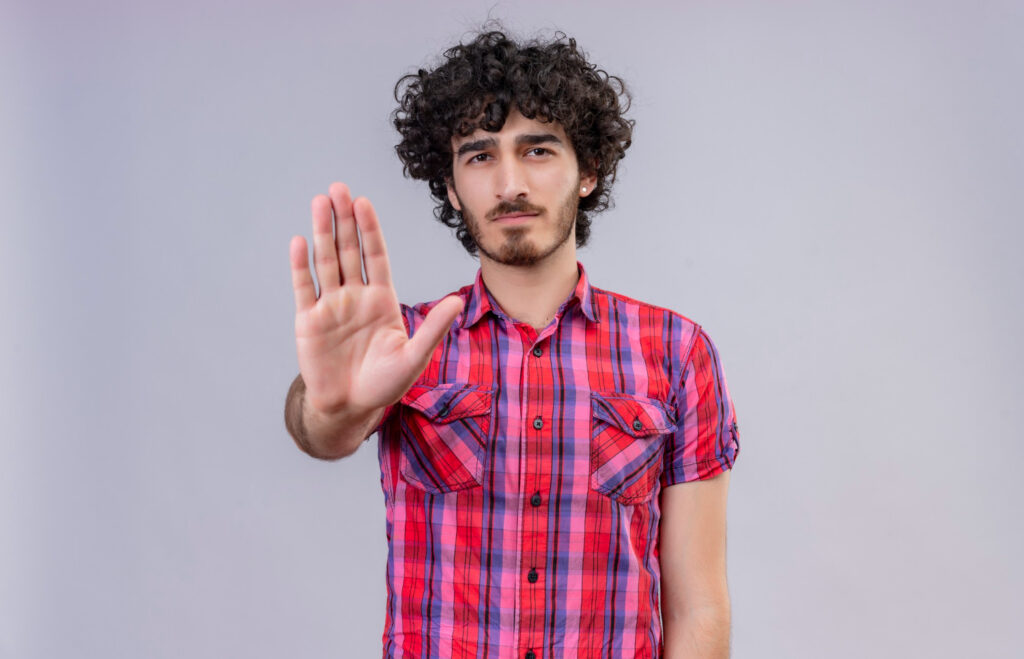 man making stop gesture with hand