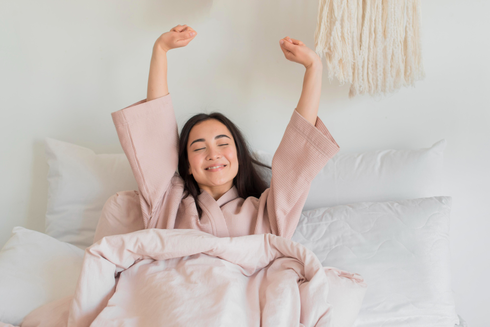 woman stretching in bed